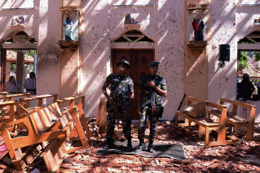 Sri Lankan military stand guard inside a church after an explosion in Negombo, Sri Lanka, April 21, 2019. Reuters/Files