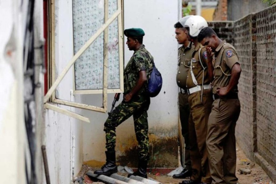 Security personnel seen at the site of an overnight gun battle, between troops and suspected Islamist militants, on the east coast of Sri Lanka, in Kalmunai, April 27, 2019. Reuters