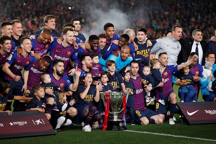 Barcelona celebrate winning La Liga with the trophy — Reuters photo