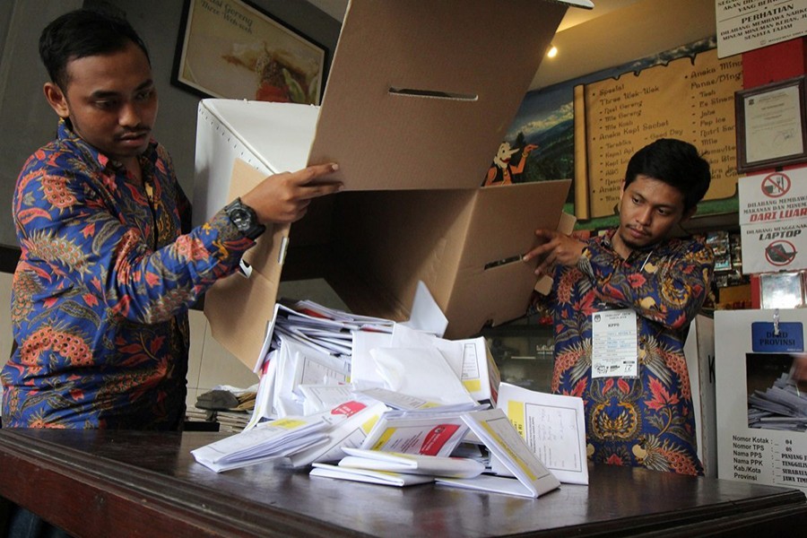 Electoral officials count ballots at a polling centre during elections in Surabaya, East Java province, Indonesia on April 17, 2019 — Antara Foto via Reuters