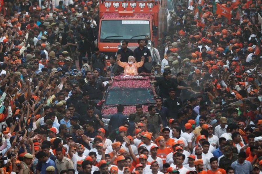 India's Prime Minister Narendra Modi waves towards his supporters during a roadshow in Varanasi, India, April 25, 2019. Reuters/File Photo