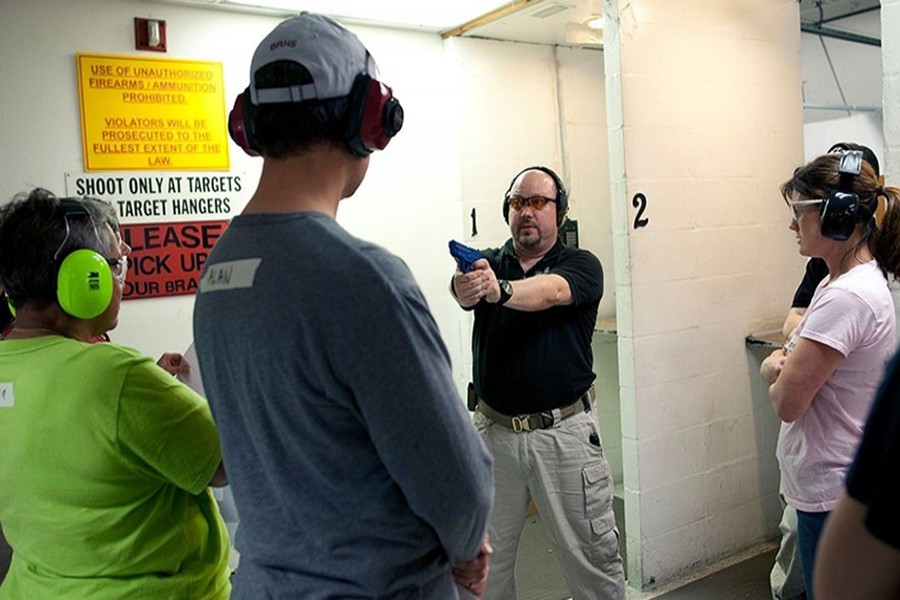 Firearms instructor Mike Magowan uses a rubber training pistol to demonstrate a shooting stance, during a teachers-only firearms training class offered for free at the Veritas Training Academy in Sarasota, Florida — Reuters/Files
