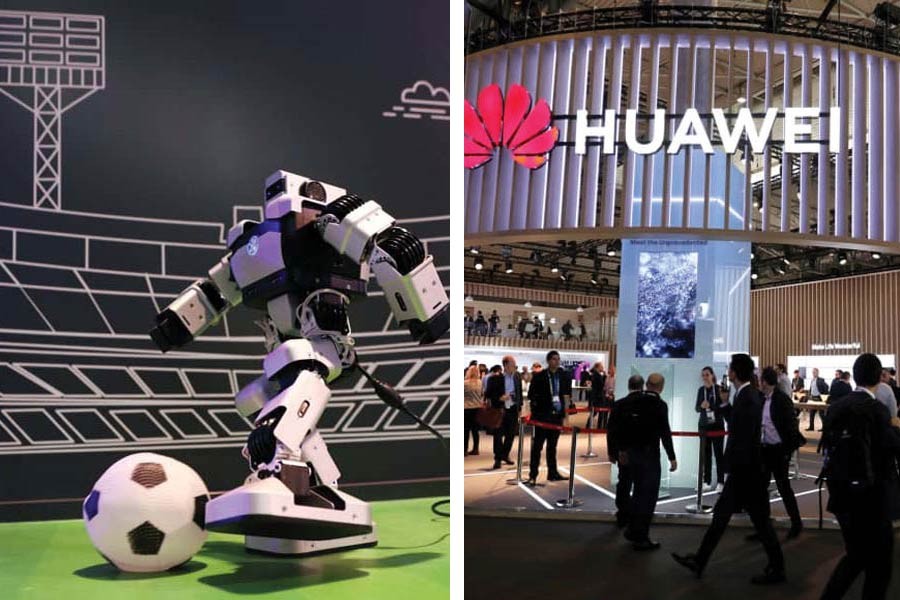 (left) A robot kicks a soccer ball inside a Huawei booth at the Mobile World Congress in Barcelona, Spain, on February 25, 2019; Visitors walk next to the Huawei booth at the Mobile World Congress in Barcelona, Spain on February 27, 2019 (right) . 	— Photos:  Reuters