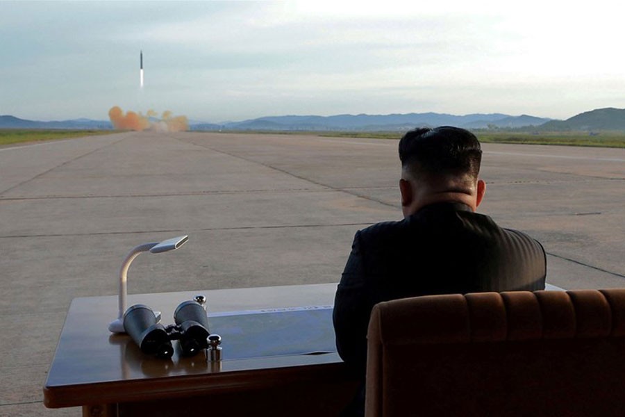 North Korean leader Kim Jong Un watches the launch of a Hwasong-12 missile in 2017 - KCNA via Reuters file