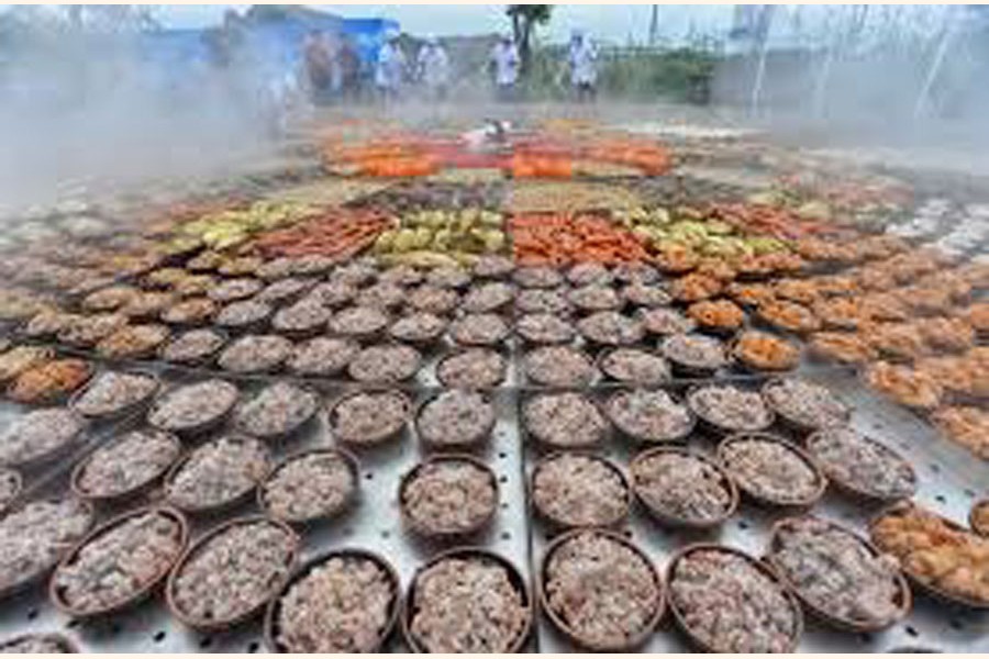 Steamed dishes are seen on a giant food steamer for an event at a tourist attraction in Xiantao, Hubei province, China 	— Reuters