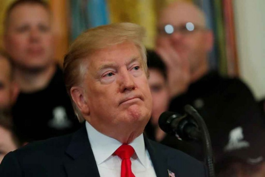 US President Donald Trump reacts as he speaks at the Wounded Warrior Project Soldier Ride event after the release of Special Counsel Robert Mueller's report, in the East Room of the White House in Washington, US, April 18, 2019. Reuters