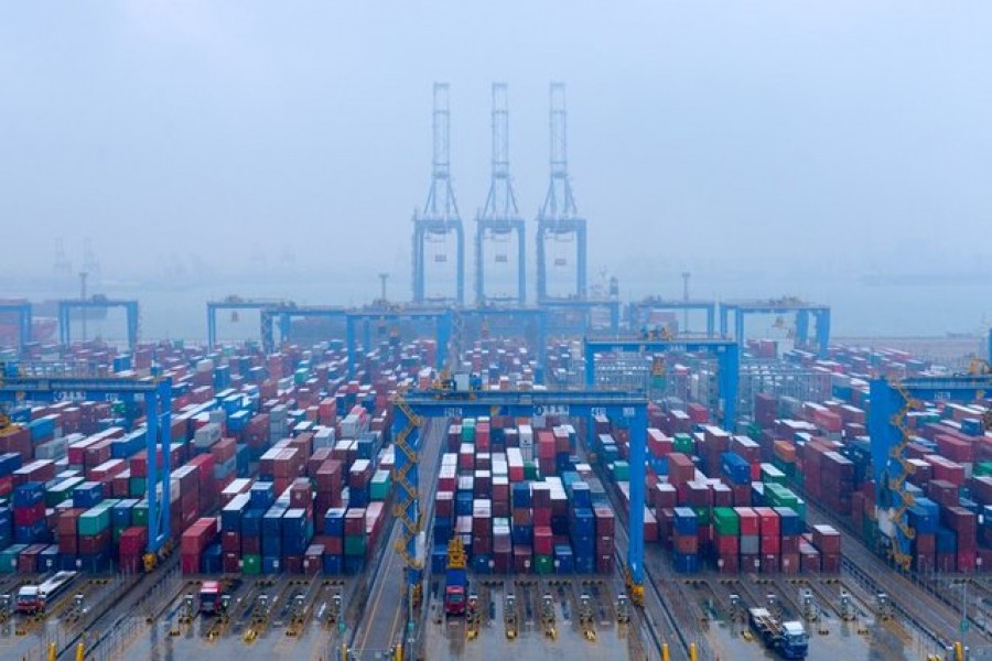 Containers and trucks are seen on a snowy day at an automated container terminal in Qingdao port, Shandong province, China, December 10, 2018, Reuters/File Photo