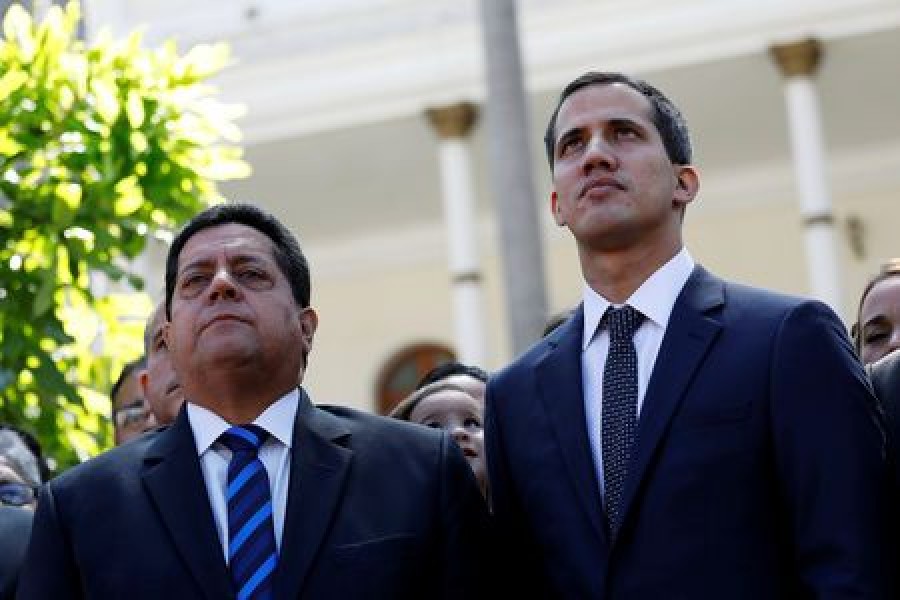 Juan Guaido (R), new President of the National Assembly and lawmaker of the Venezuelan opposition party Popular Will (Partido Voluntad Popular), and lawmaker Edgar Zambrano of Democratic Action party (Accion Democratica), leave the congress after Guaido's swearing-in ceremony, in Caracas, Venezuela January 5, 2019. Reuters