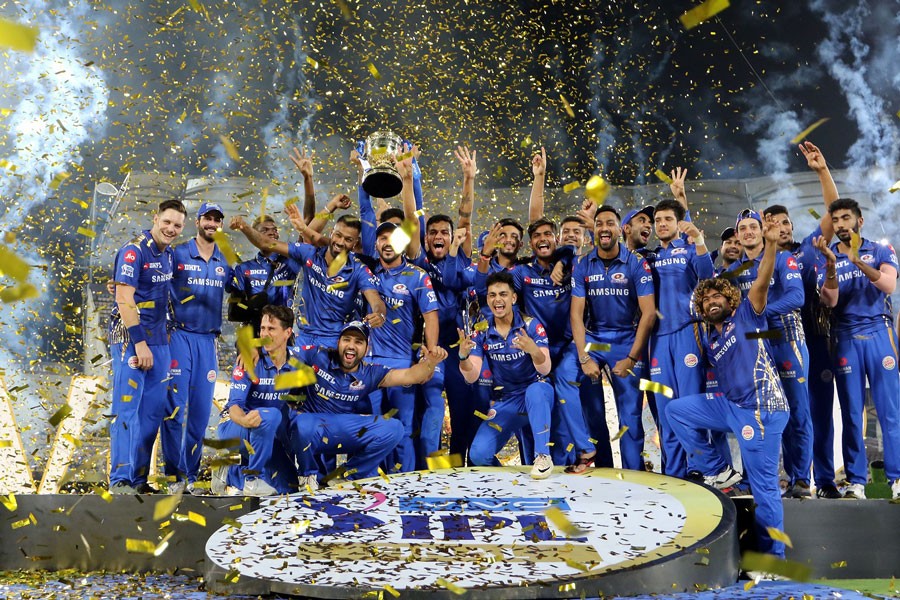 The Mumbai Indians players posing with the IPL 2019 trophy	— BCCI