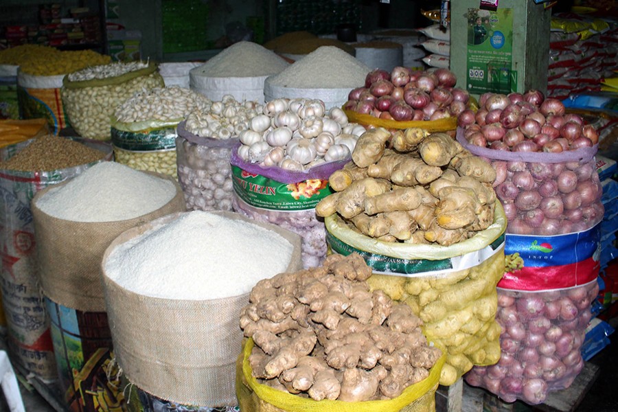 Bags of ginger, garlic, and onions along with other commodities are seen on display for sale at Kaptan Bazar in the capital city — Focus Bangla/Files