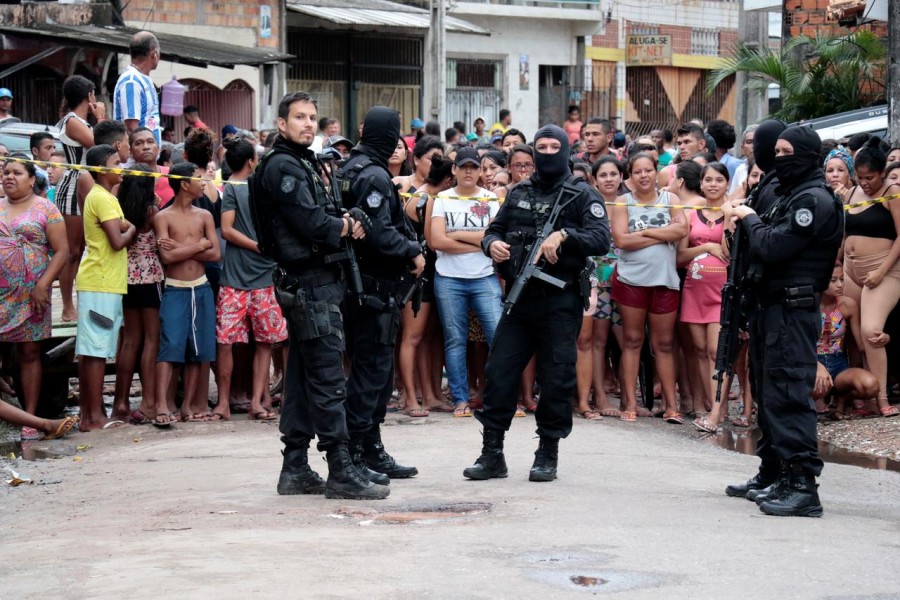 Policemen guard a site where, according to local media, an armed group entered and opened fire at a bar, killing 11, in Belem, Para state, Brazil - STRINGER/Reuter