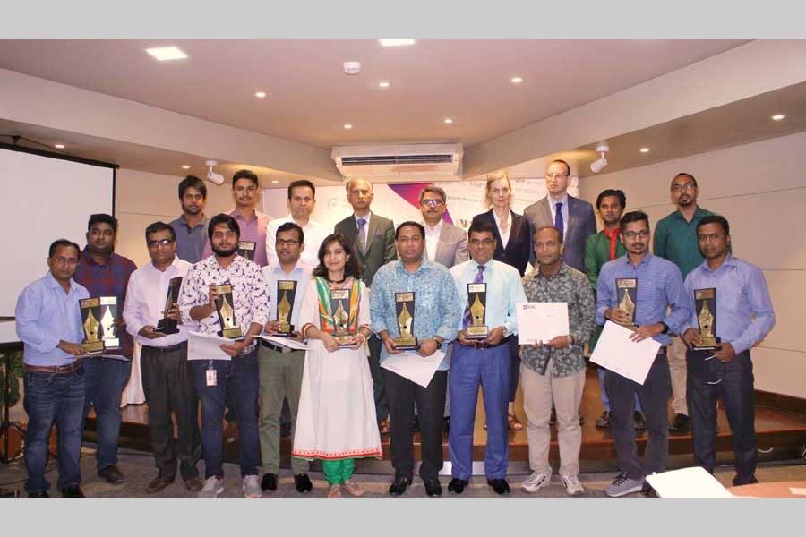 Awardees are seen at the ‘Brac Migration Media Award’ programme in the city on Tuesday.