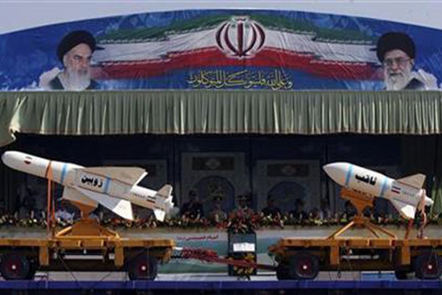 A military vehicle carrying Iranian Zoobin smart bomb (L) and Sagheb missile under pictures of Iran's Supreme Leader Ayatollah Ali Khamenei (R) and Late Leader Ayatollah Ruhollah Khomeini during a parade to commemorate the anniversary of the Iran-Iraq war (1980-88), in Tehran, September 22, 2011. Reuters/Files