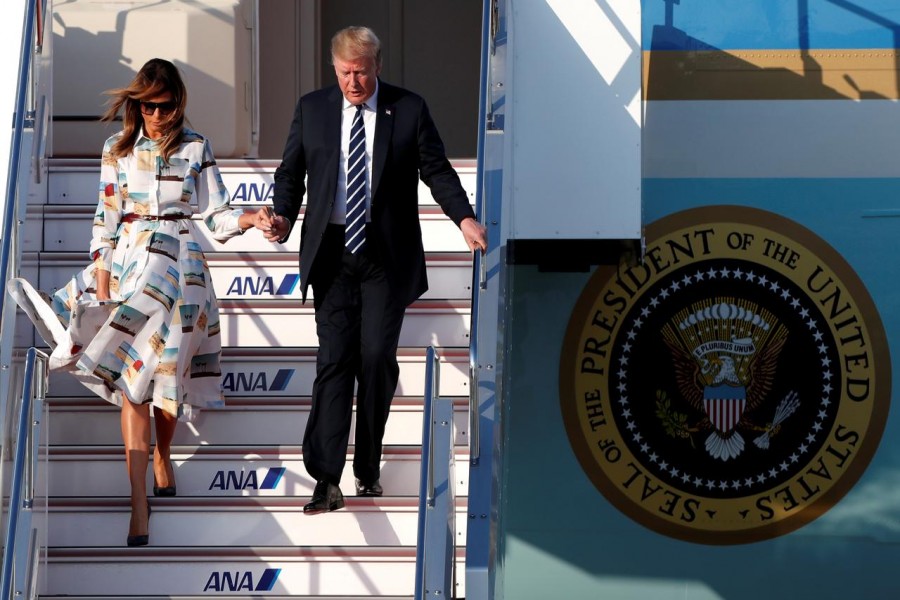 US President Donald Trump and first lady Melania Trump arrive aboard Air Force One at Tokyo Haneda Airport in Tokyo, Japan, May 25, 2019. Reuters