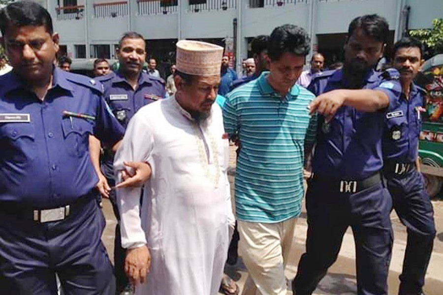 SM Sirajuddoula, the suspended principal of Feni's Sonagazi madrasa and also the prime accused in Nusrat murder, is being escorted to the court in this undated Focus Bangla photo