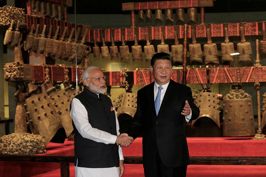 Chinese President Xi Jinping and Indian Prime Minister Narendra Modi shake hands as they visit the Hubei Provincial Museum in Wuhan, Hubei province, China on April 27, 2018 — China Daily via Reuters file photo