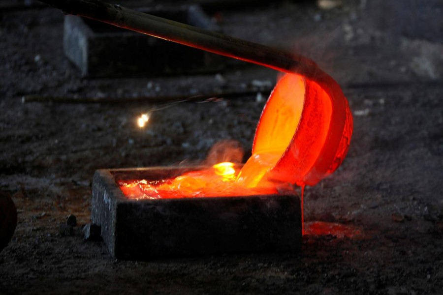 Molten rare earth metal Lanthanum is poured into a mold at Jinyuan Company's smelting workshop near the town of Damao in China's Inner Mongolia Autonomous Region, October 31, 2010. Reuters/Files
