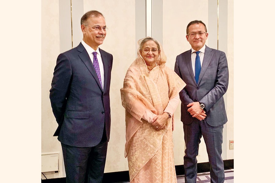 Prime Minister Sheikh Hasina is flanked by Jun Nishizawa, Group CEO of Natural Gas Group of Mitsubishi Corporation, and Muhammed Aziz Khan (left), Founder Chairman of Summit Group, in a meeting in Tokyo on Thursday