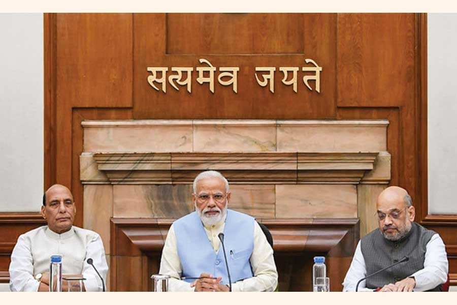 Prime Minister Narendra Modi (centre) with Union Ministers Rajnath Singh (left) and Amit Shah  (right) during the first cabinet meeting of his second term in office, at the Prime Minister's Office, in South Block, New Delhi on May 31, 2019.  —Photo courtesy: PTI via the Internet