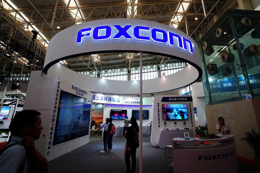 Visitors are seen at a Foxconn booth at the World Intelligence Congress in Tianjin, China on May 19, 2018 — Reuters/Files