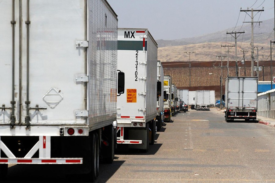 Trucks wait in queue for border customs control, to cross into the U.S., at the Otay border crossing in Tijuana, Mexico on June 7, 2019 — Reutersphoto