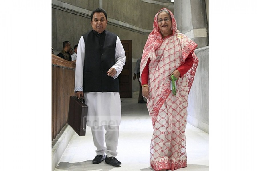 Prime Minister Sheikh Hasina and Finance Minister AHM Mustafa Kamal emerging from a cabinet meeting after signing the approved national budget for fiscal 2019-20 on Thursday. Photo: PID