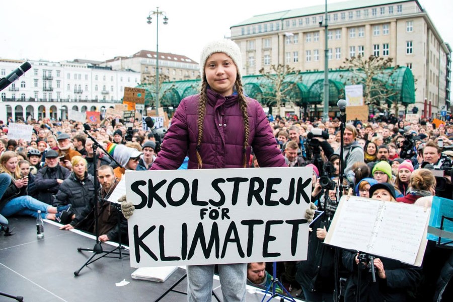 Swedish climate activist Greta Thunberg holds a sign reading, "School strike for the climate," as she attends a rally in Hamburg, Germany on March 01, 2019.                 —Photo: AP