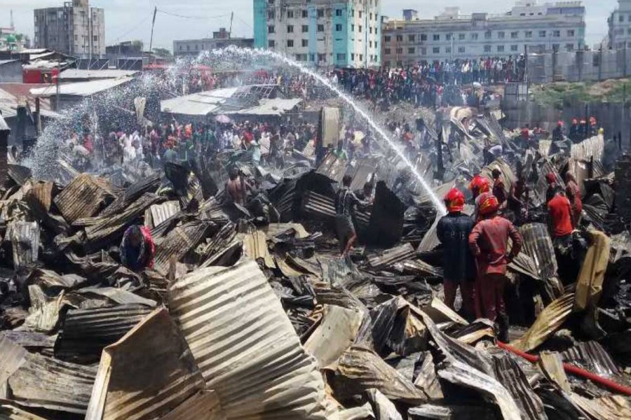 At least 100 shanties and eight shops are gutted in a fire at Chaktai Bhera Market in Bakolia area of the city on Thursday, June 20, 2019 - Photo: UNB