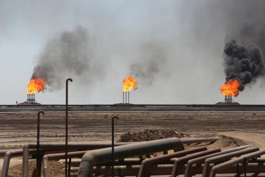 Flames emerge from the flare stacks at the West Qurna-1 oilfield, which is operated by ExxonMobil, near Basra, Iraq, June 1, 2019. Reuters/File Photo