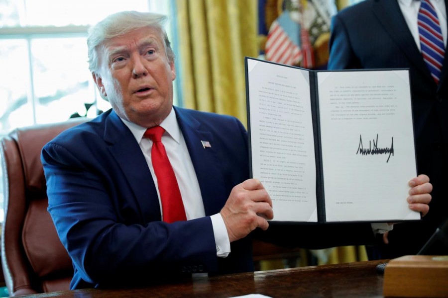 US President Donald Trump displays an executive order imposing fresh sanctions on Iran in the Oval Office of the White House in Washington, US, June 24, 2019. Reuters