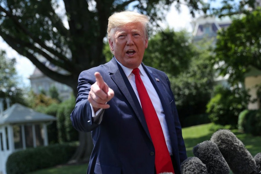 US President Donald Trump talks to reporters as he departs for travel to the G20 Summit in Osaka, Japan at the White House in Washington, US, June 26, 2019. Reuters
