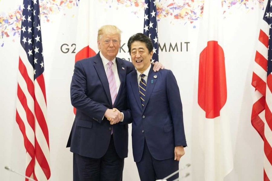 US President Donald Trump shakes hands with Japan's Prime Minister Shinzo Abe during the G20 leaders summit in Osaka, Japan, June 28, 2019. Reuters