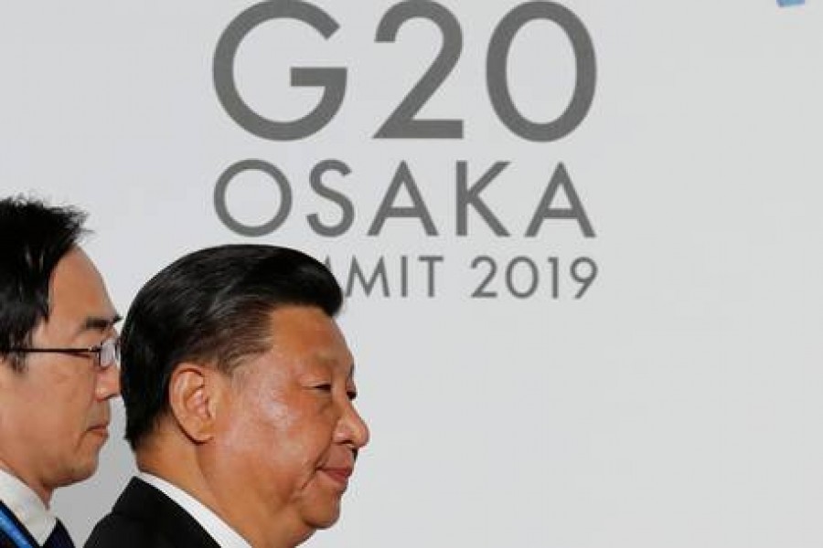 Chinese President Xi Jinping arrives for an welcome and family photo session at G20 leaders summit in Osaka, Japan, June 28, 2019. Reuters