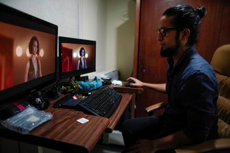 Independent Cuban clip director Joseph Ross works on his desk prior to an interview in Havana, Cuba, June 27, 2019. Reuters
