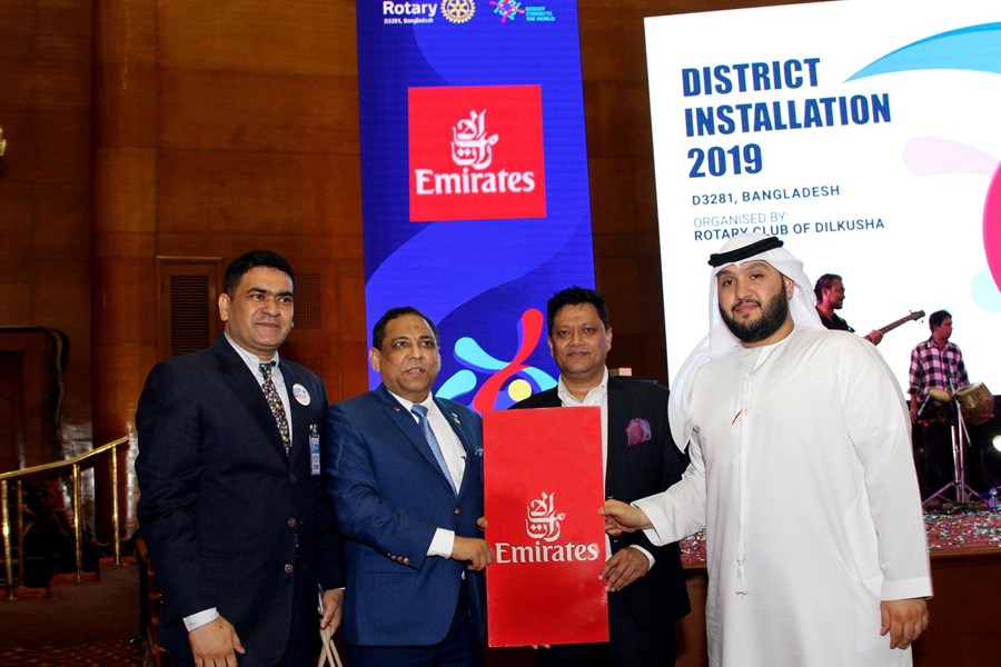 Emirats Sales Manager in Bangladesh Mohammed Mohijur Rahman is handing over two air tickets to Rtn. M. Khairul Alam, Governor, Rotary International District 3281