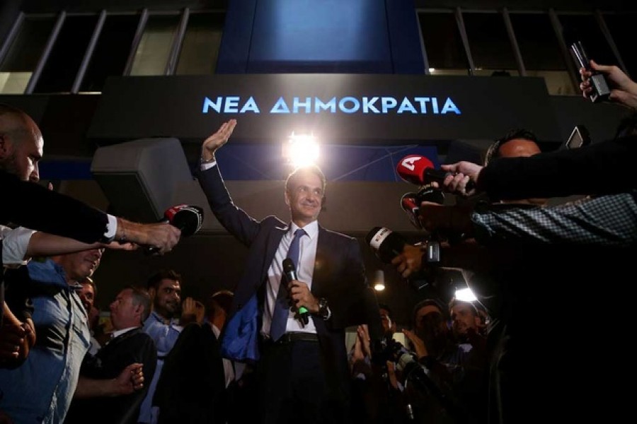 New Democracy conservative party leader Kyriakos Mitsotakis waves as he speaks outside party's headquarters, after the general election in Athens, Greece, July 7, 2019. Reuters