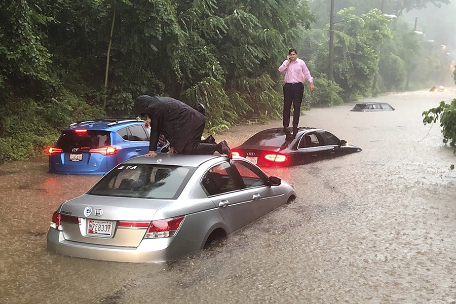 Motorists are stranded on a flooded section of Canal Road in Washington during a heavy rainstorm on Monday — AP photo