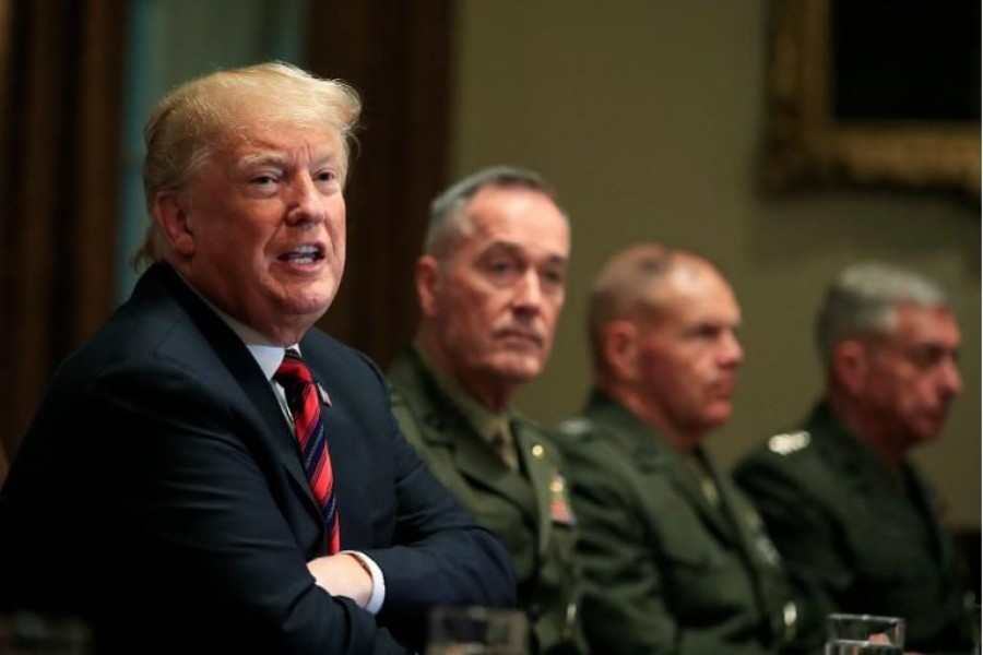 From left, President Donald Trump with Chairman of the Joint Chiefs of Staff General Joseph Dunford and Marine Corps Commandant General Robert Neller, speaks during a briefing with senior military leaders in the Cabinet Room at the White House in Washington, October 23, 2018 - AP Photo/Manuel Balce Ceneta