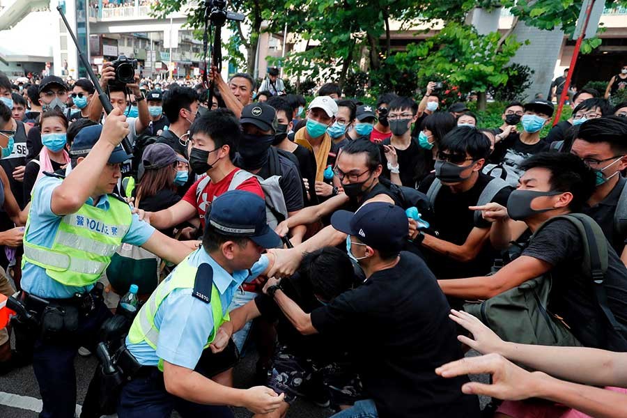 Police try to disperse pro-democracy activists after a march at Sheung Shui, a city border town in Hong Kong, China on Saturday. -Reuters Photo