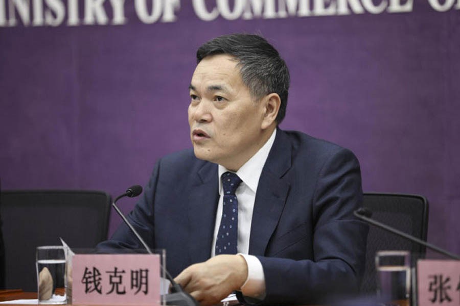 Vice Minister of Commerce Qian Keming speaking at a press conference in Beijing on Friday	— AP