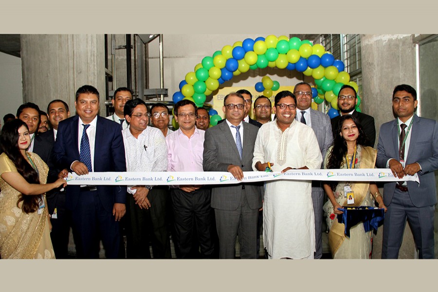 State minister for ICT Zunaid Ahmed Palak cuts a ribbon during the inaugural event of EBL ATM and Dropbox services on the premises of the ministry in presence of, among others, the bank's managing director and CEO Ali Reza Iftekhar and head of retail and SME banking M Khorshed Anowar