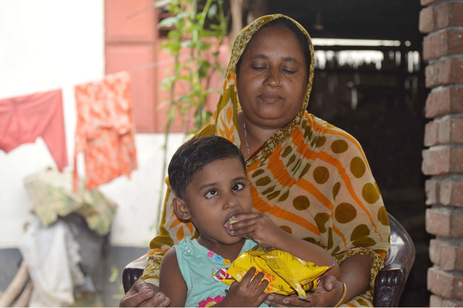 Nazma Begum with her daughter Suraiya  	— FE Photo