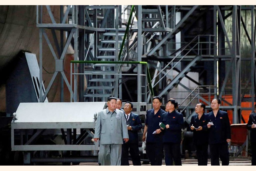 North Korean leader Kim Jong Un visiting a submarine factory in an undisclosed location    	— Reuters