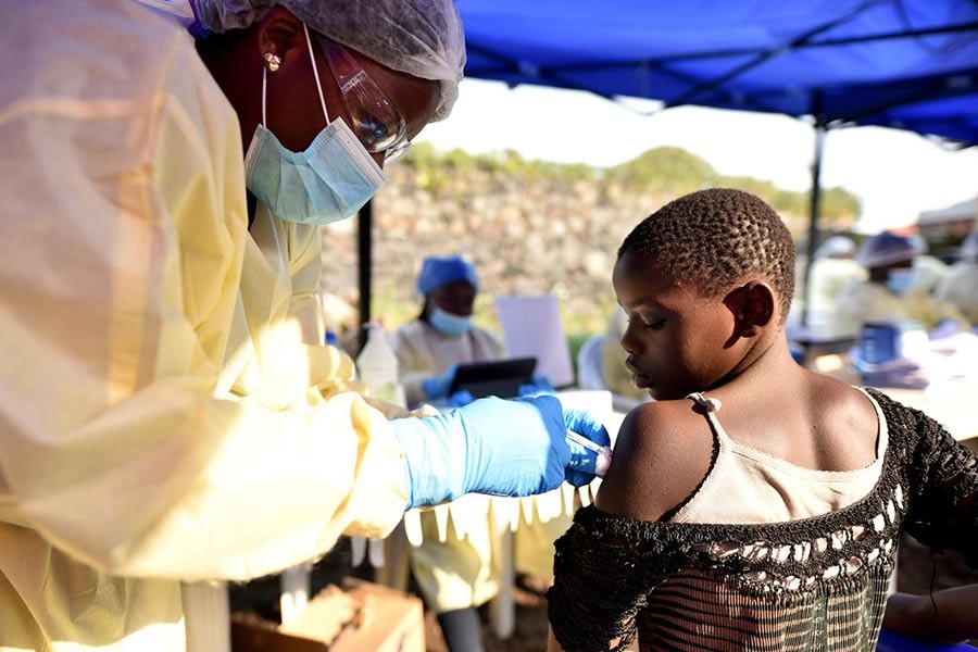 A Congolese health worker administering ebola vaccine to a child at the Himbi Health Centre in Goma of Democratic Republic of Congo recently. -Reuters Photo