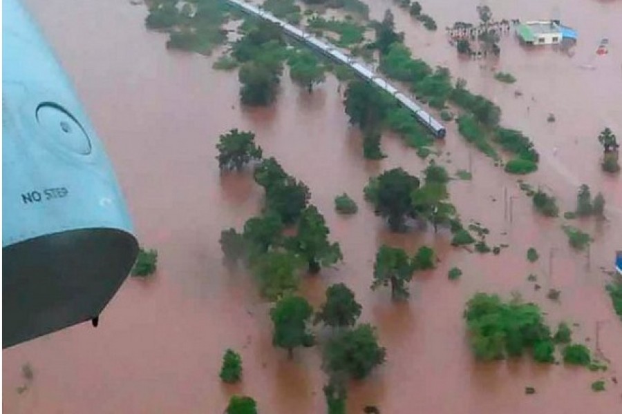 Rescuers evacuate passengers from flood-stuck train near Mumbai