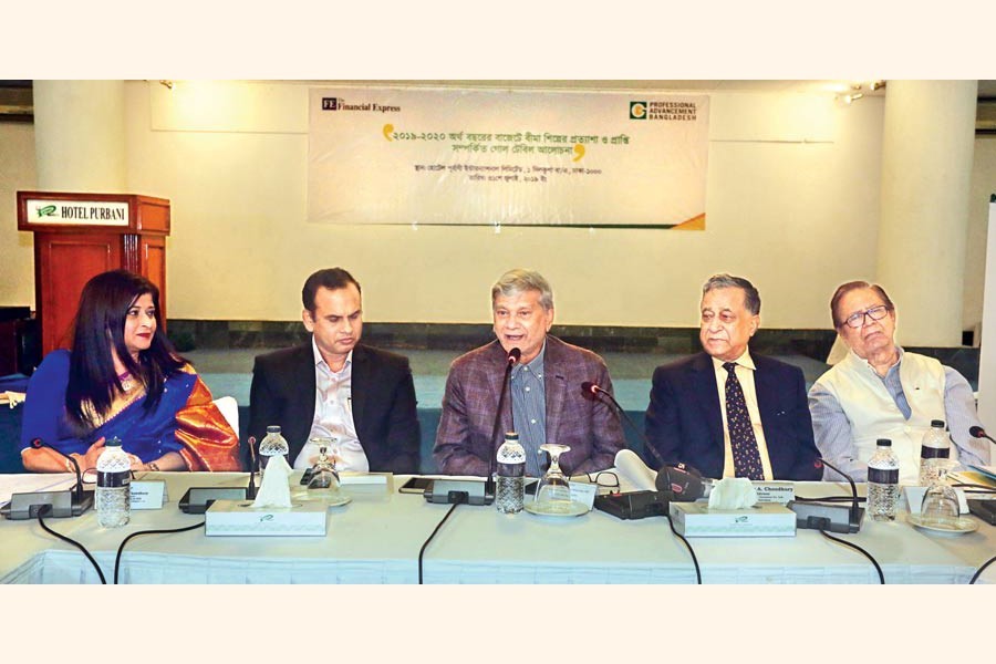 Planning Minister MA Mannan (centre) speaking at a roundtable on 'Budget for fiscal year 2019-20: Insurance industry's expectations and outcome’ at a city hotel on Wednesday. Professional Advancement Bangladesh Limited Chairman Nasir A Choudhury (2nd, right), The Financial Express Editor Shah Husain Imam (extreme right), Insurance Development and Regulatory Authority member Dr Mosharraf Hossain (2nd, left) and MD and CEO of Green Delta Insurance Company Farzanah Chowdhury were also present — FE Photo