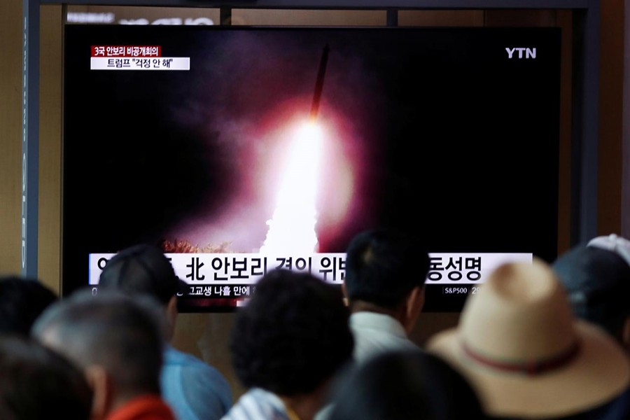 People watch a TV showing a file picture of a North Korean missile for a news report on North Korea firing short-range ballistic missiles, in Seoul, South Korea on August 2, 2019 — Reuters photo