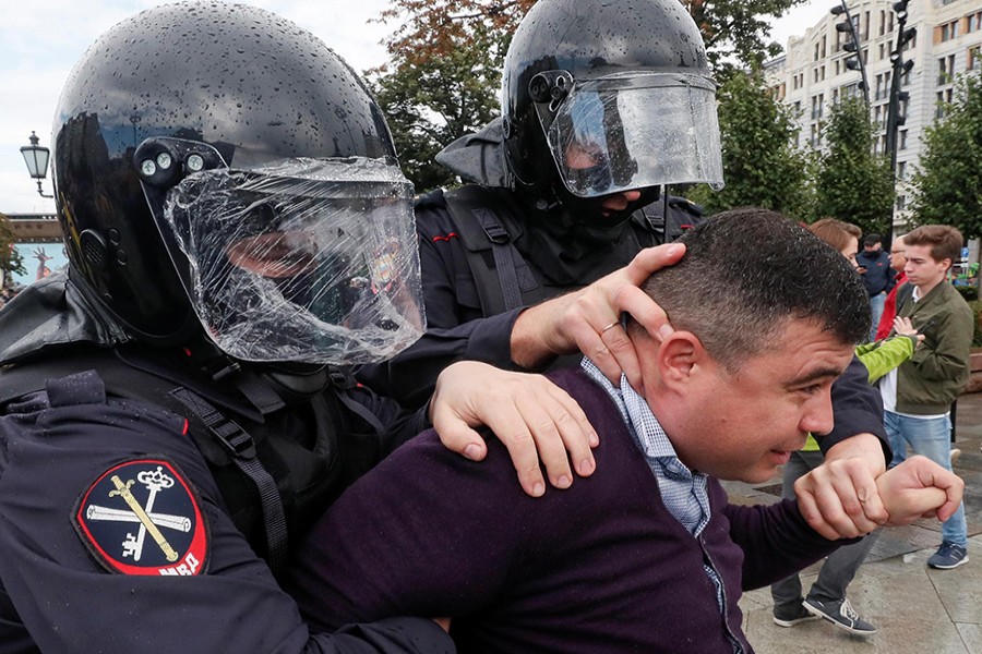 Law enforcement officers detain a participant in a rally calling for opposition candidates to be registered for elections to Moscow City Duma, the capital's regional parliament, in Moscow, Russia on August 3, 2019 — Reuters photo