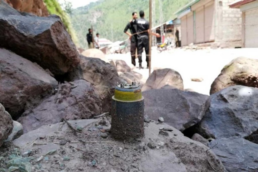 A cluster bomb shell is seen along a roadside in Noseri, near the line of control (LOC), in Neelum Valley in Kashmir, August 4, 2019. Reuters