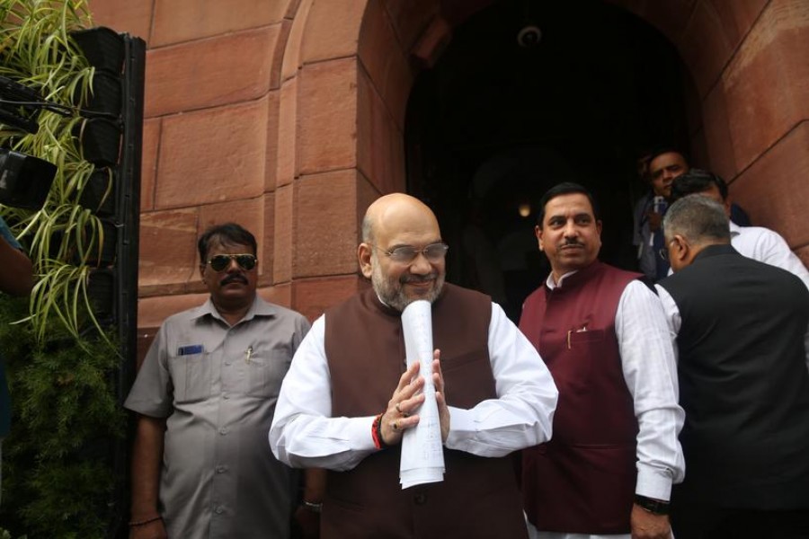 India's Home Minister Amit Shah greets the media upon his arrival at the parliament in New Delhi, India, August 5, 2019. Reuters/Stringer